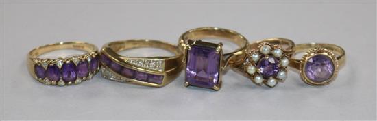 Five assorted 9ct gold and gem set rings including amethyst and diamond.